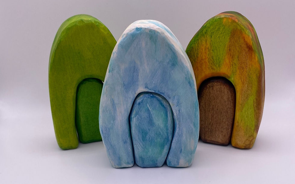 image shows section of painted wooden toy scenery pieces against a white background.