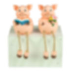 set of 2 resin pig figurines dangling legs holding book and flowers