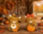 Two fall Highland cow figurines with pumpkins and sunflower accents, wearing a top hat and red bow in a harvest theme.