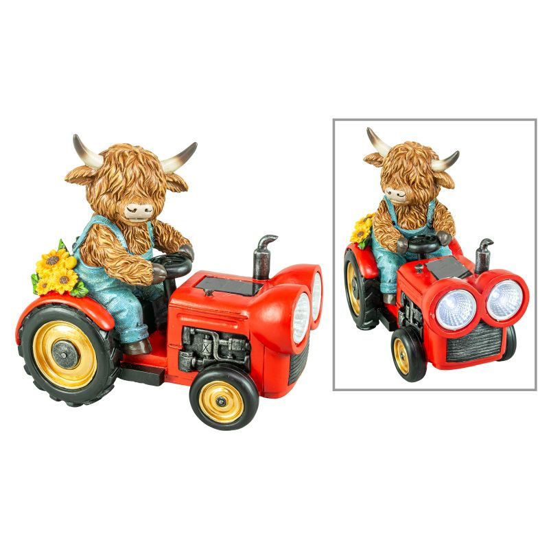 Resin Highland cow figurine wearing overalls riding a red tractor