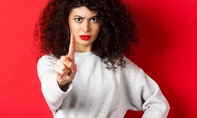Serious confident woman say no, extend o