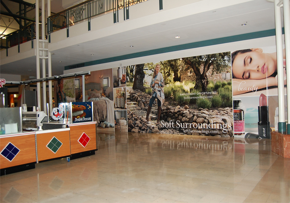 Full wall graphics /  wall mural advertising a store coming soon in a mall.