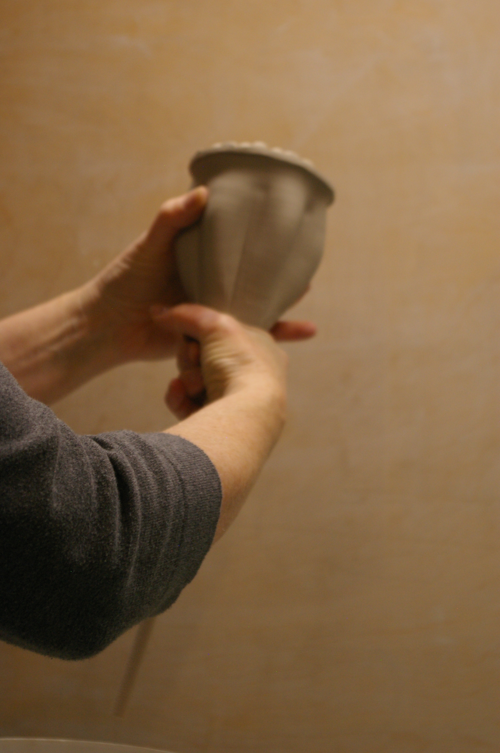 with wet hand, squeeze the base