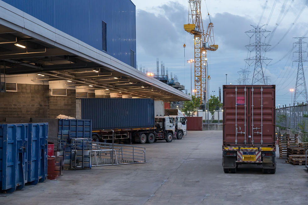 vecteezy_truck-is-carrying-container-parking-in-front-warehouse_36192288.jpg