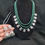Thumbnail: Multi layered green semi precious bead lakshmi kasu necklace set