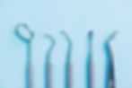 Dental instruments Dentists tools on blue background