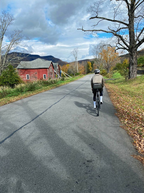 cyclist in hudson valley on farm rd near redhook, ny