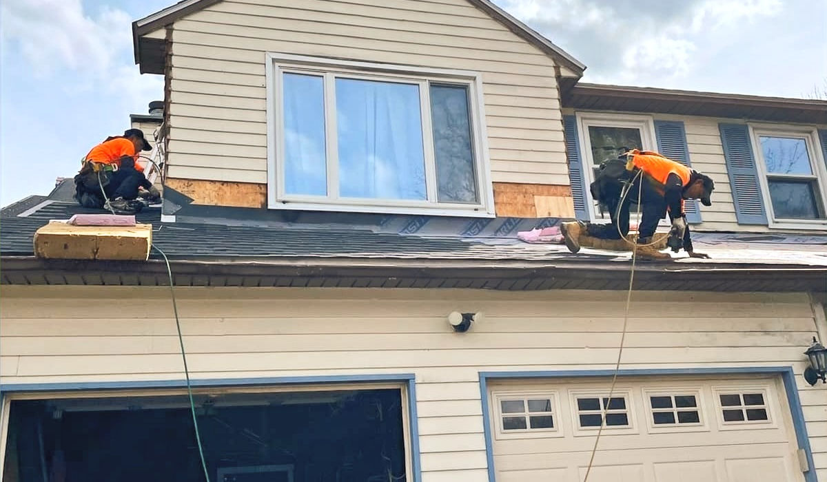 roofers replacing asphalt shingle roof