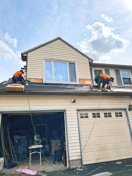roofers replacing asphalt shingle roof