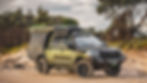 Chopped 200 Series LandCruiser in custom Nori Green parked on the beach. full touring setup, featured in a 4X4 magazine.