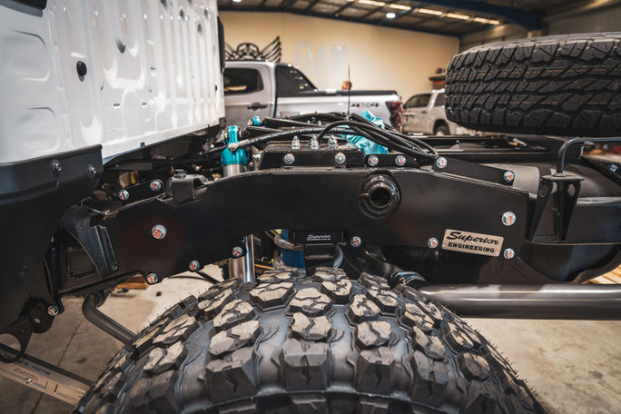 Chassis-mounted Superior Engineering coil cradle installed in 79 Series LandCruiser