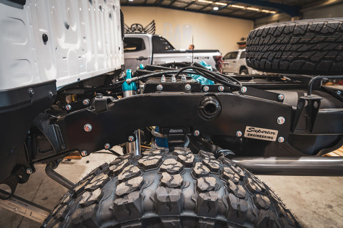 Chassis-mounted Superior Engineering coil cradle installed in 79 Series LandCruiser