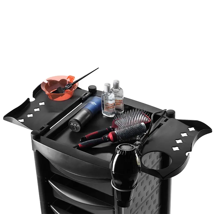 Close-up view of cosmetology tools arranged neatly on a salon workstation