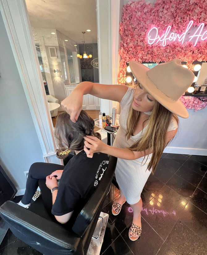 Cosmetology Instructor demonstrating hair styling techniques