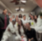 Eye-level view of cosmetology classroom with styling chairs and mirrors