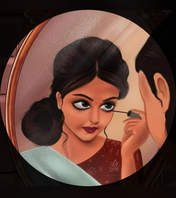 A girl applying kajal to her eyes and looking into the mirror.