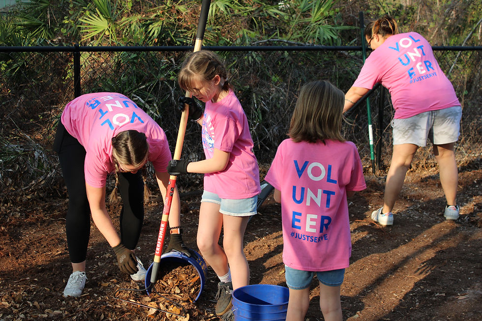 Volunteers with Light Orlando work together to refurbish the Playground for residents at the S.T.E.P.S program in partnership with One Heart for Women and Children- Orlando