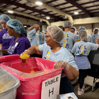 Light Orlando Volunteers working together to build one million meals
