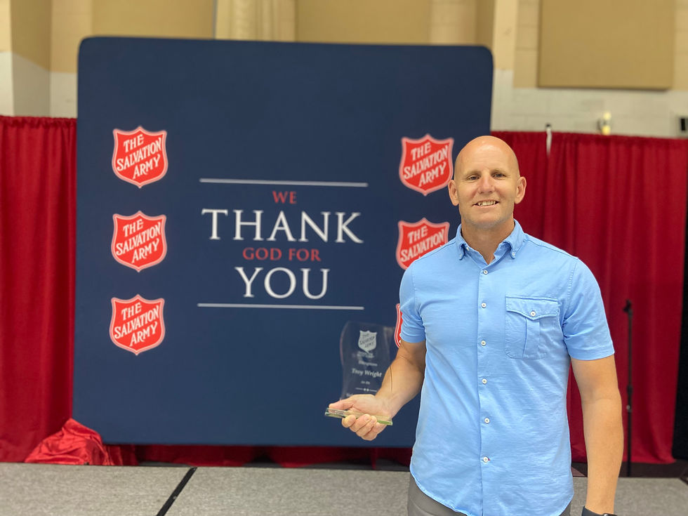 Light Orlando Program Officer Troy Wright accepts The Salvation Army's Volunteer of the Year Award in 2022