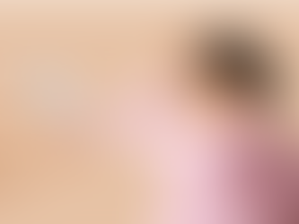 A woman holds a hand to her head while two brain graphics are handed to her