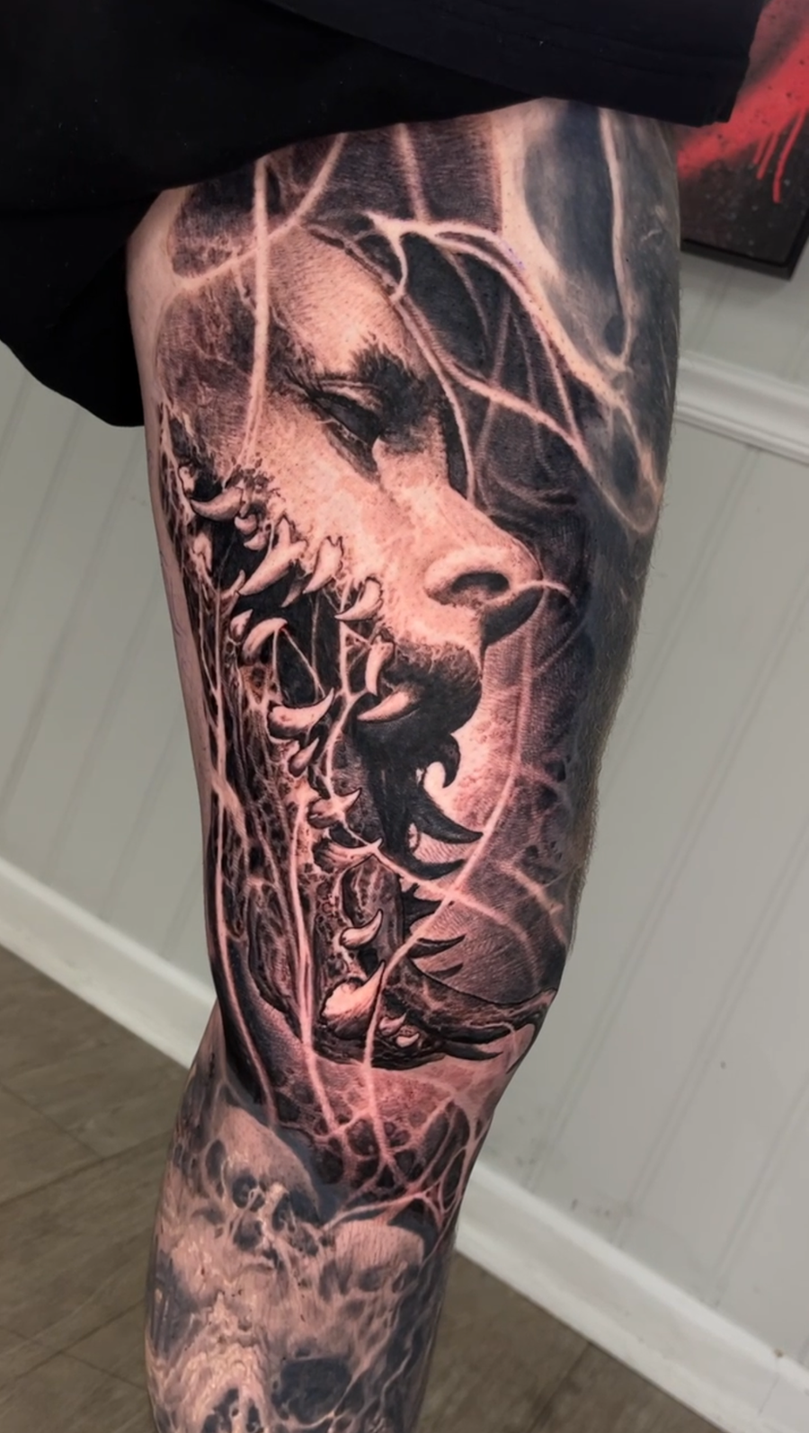 Surreal black and grey creature tattoo by Robby Latos