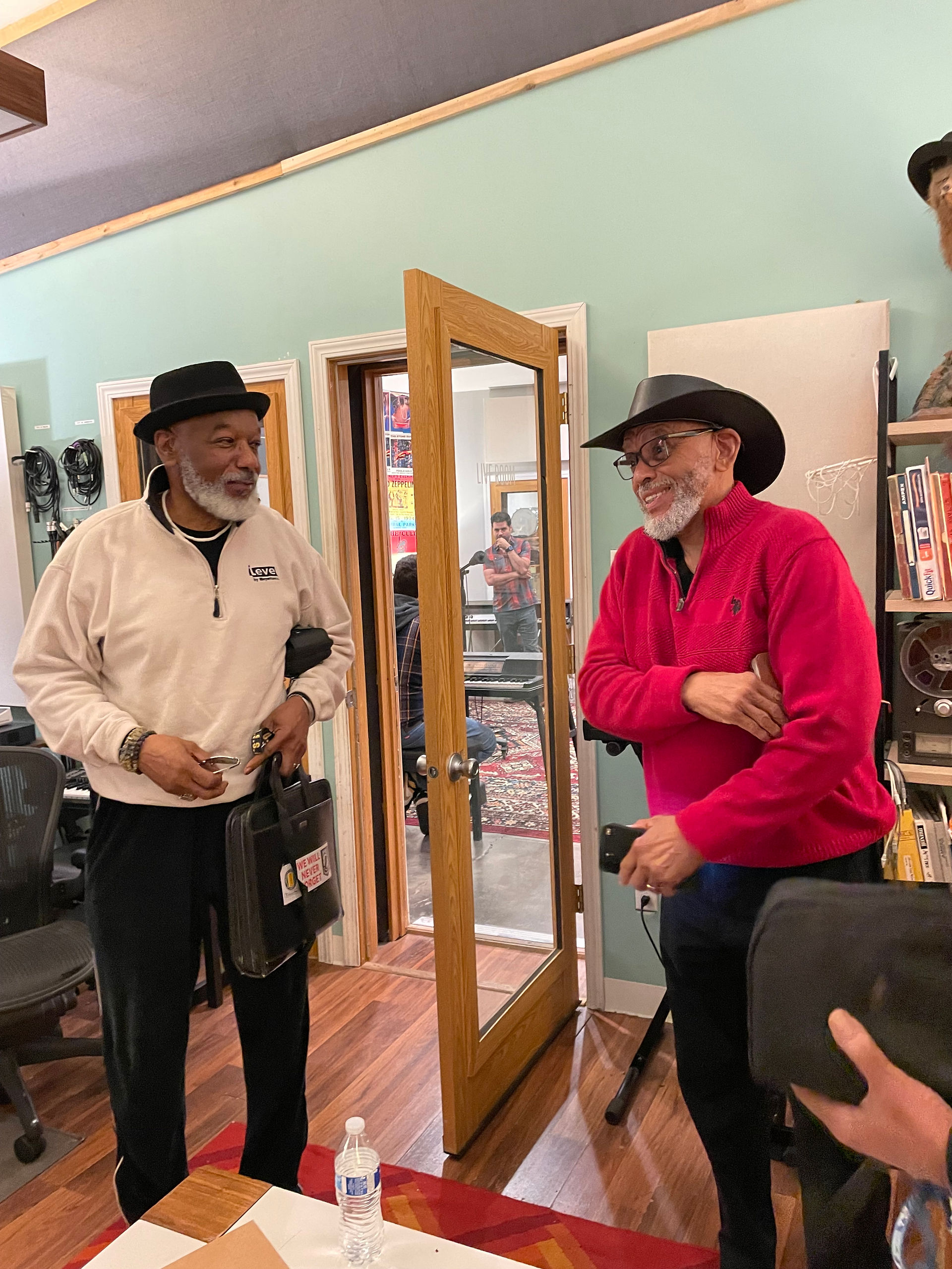 Two people standing together and talking