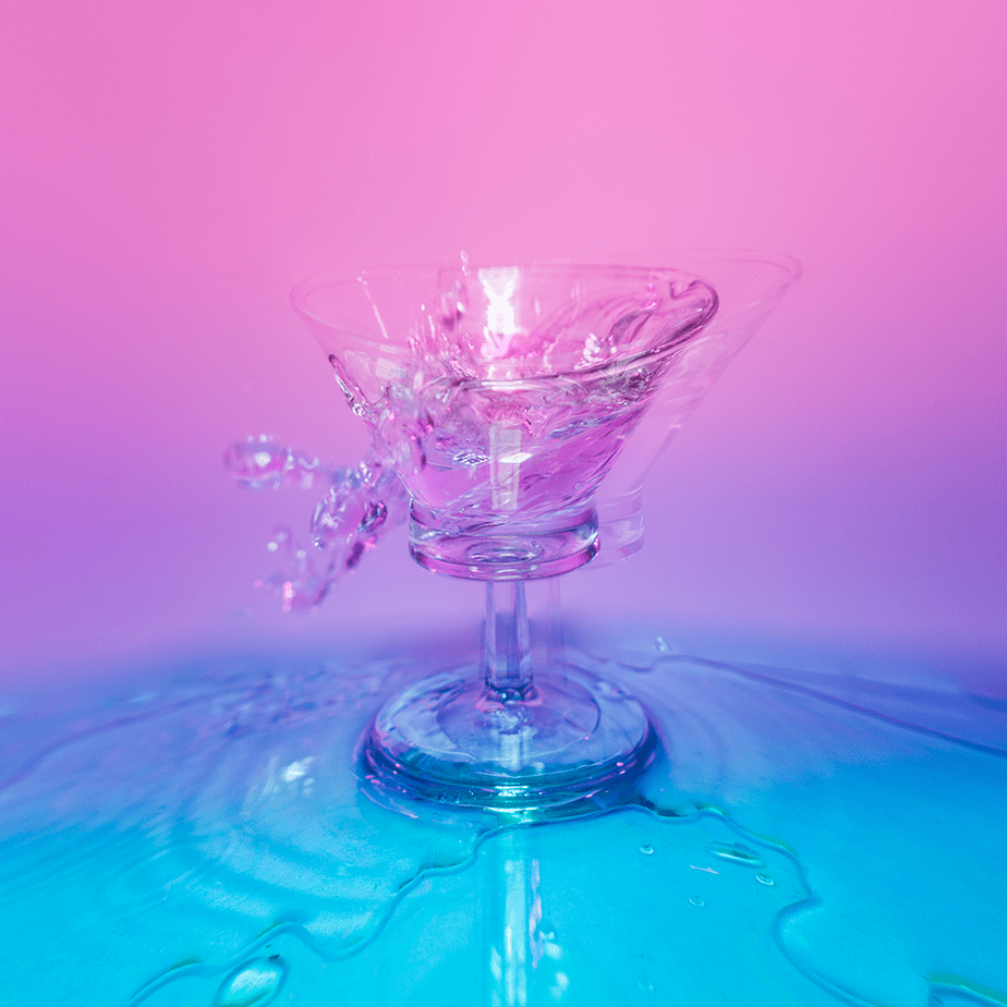 pink and blue glass cup splashed with liquid