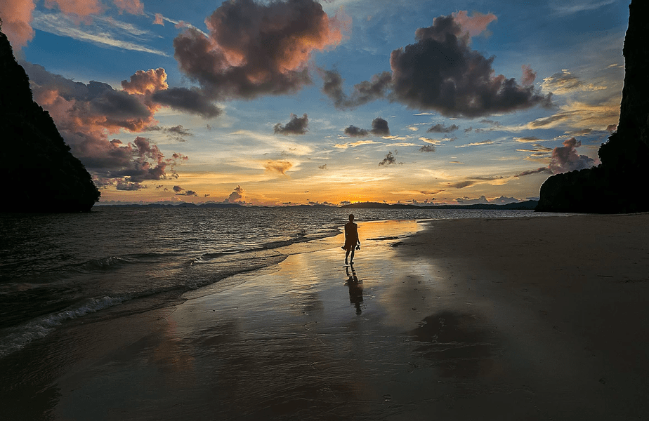 woman on the beach in sunset