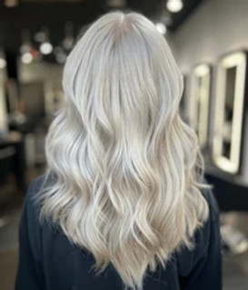 Back view of long platinum blonde hair styled in soft waves