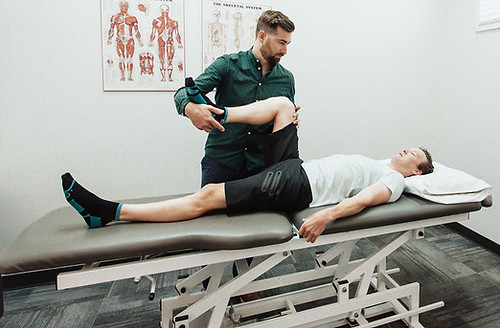 Davis Treating Patient Laying Down - Winnipeg Osteopath