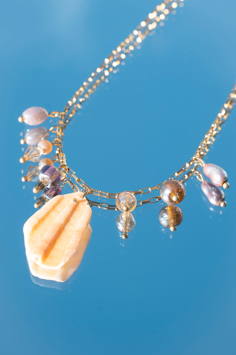 Thumbnail: vintage violet and ocean shell necklace