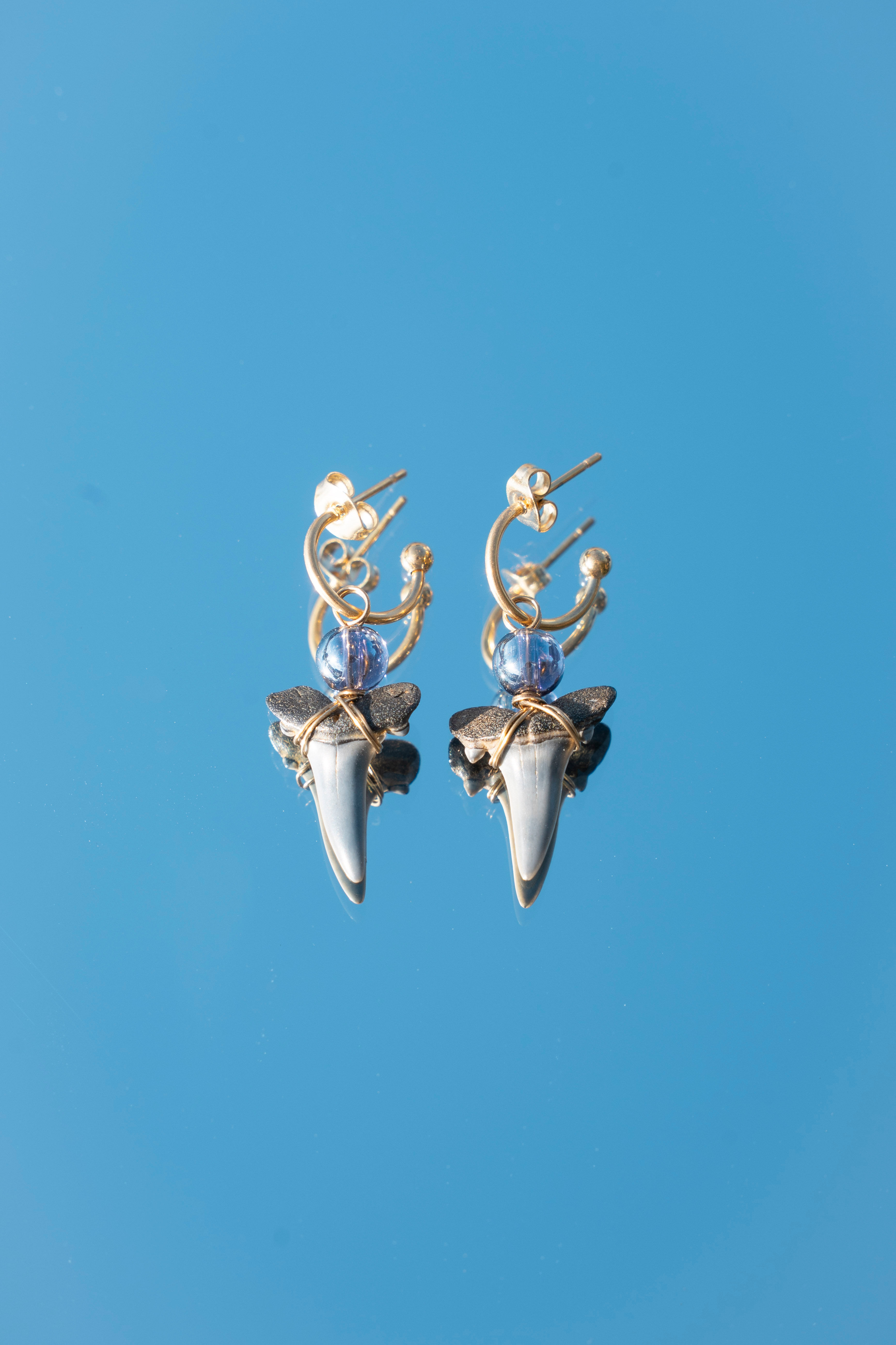 purple glass shark teeth earrings