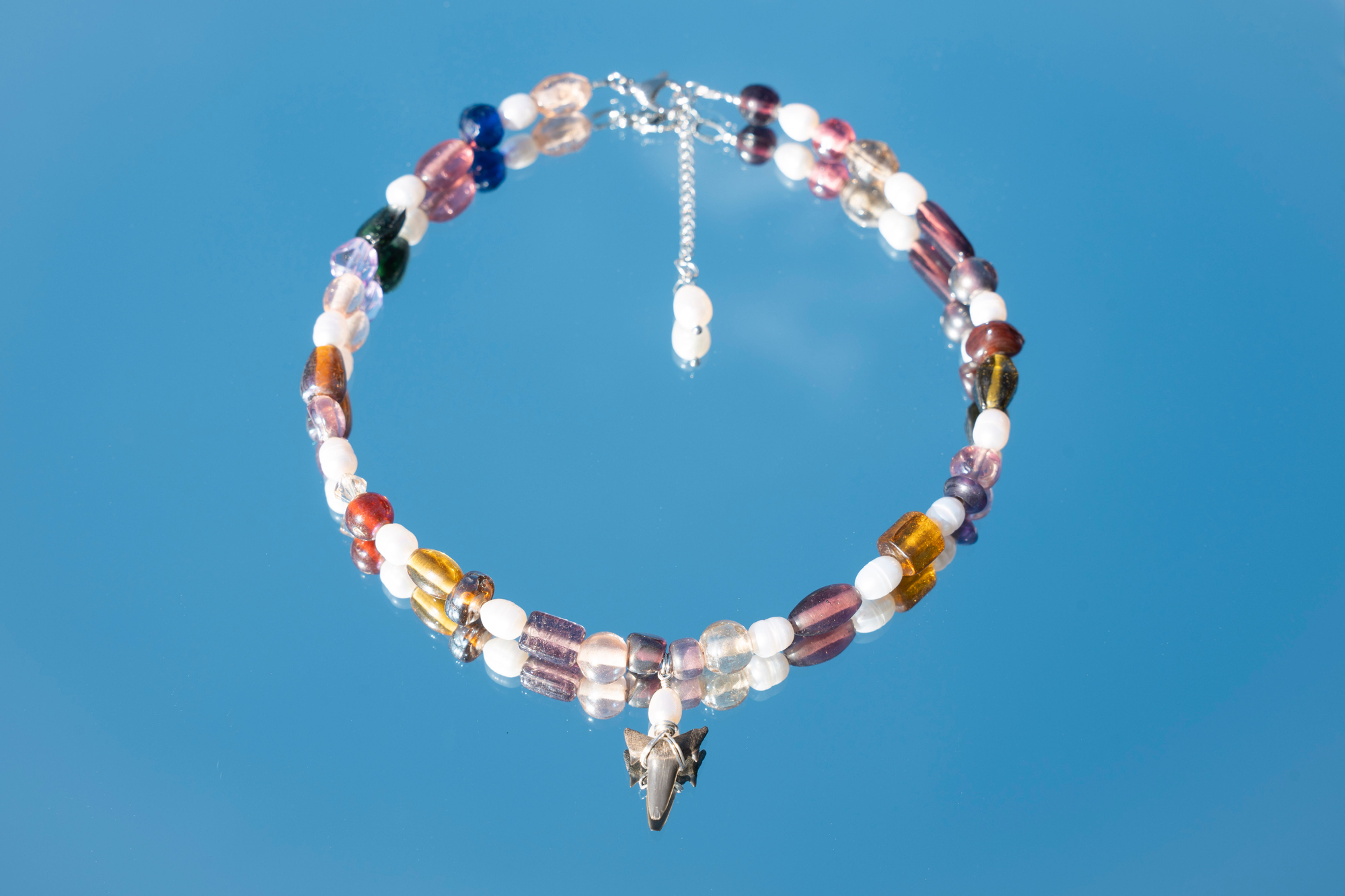 the purple sunrise shark necklace