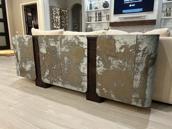 Custom living room media gallery with reclaimed wood and hand-aged metal accents in Sarasota home