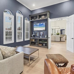 Custom media built-in and library wall in a weathered gray finish, Lakewood Ranch FL