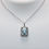 Thumbnail: Emerald Cut Aquamarine Halo Necklace in 14K White Gold