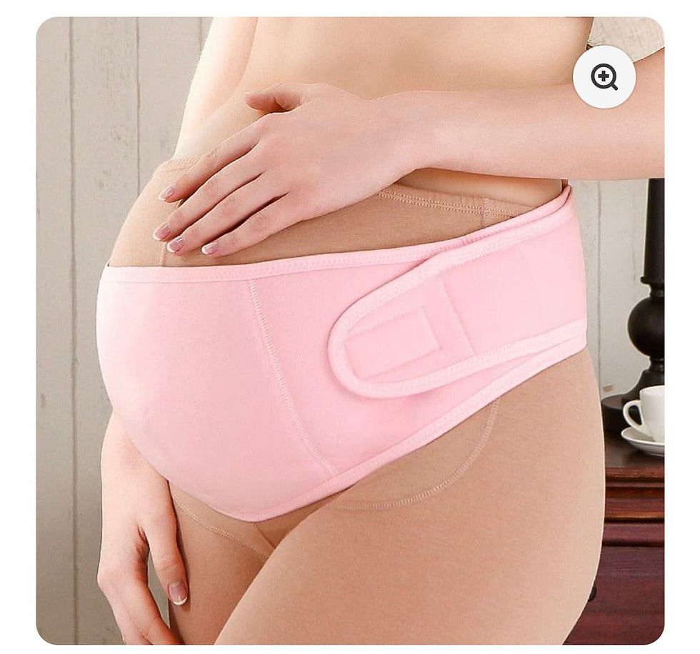 Pink maternity support belt worn on a pregnant belly.