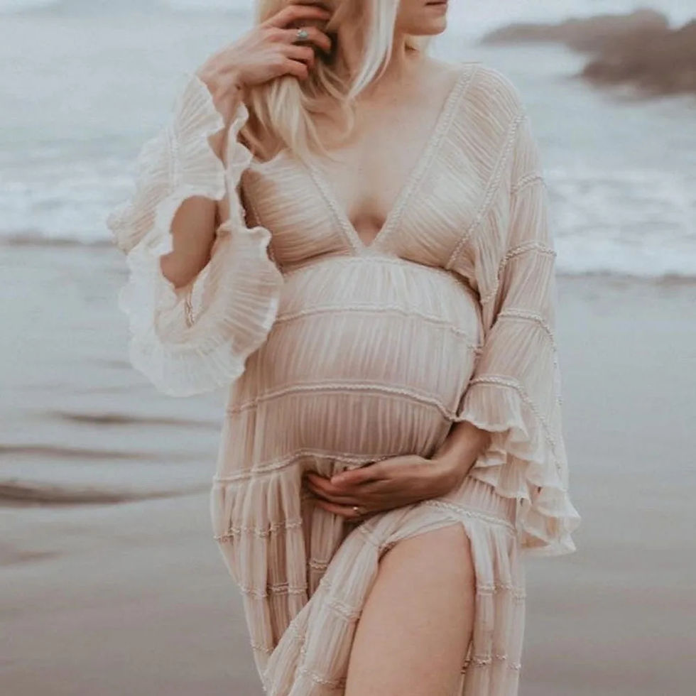 Thumbnail: Pregnant woman in a flowing dress at Lemon Poppyseed beach.