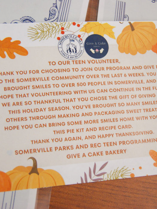 A colorful autumn-themed thank-you card from Give A Cake Bakery and Somerville Parks and Recreation expressing gratitude to teen volunteers for their community service.