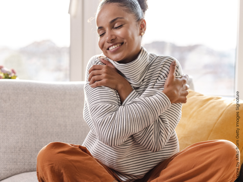 A woman hugging herself