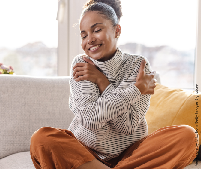 A woman hugging herself