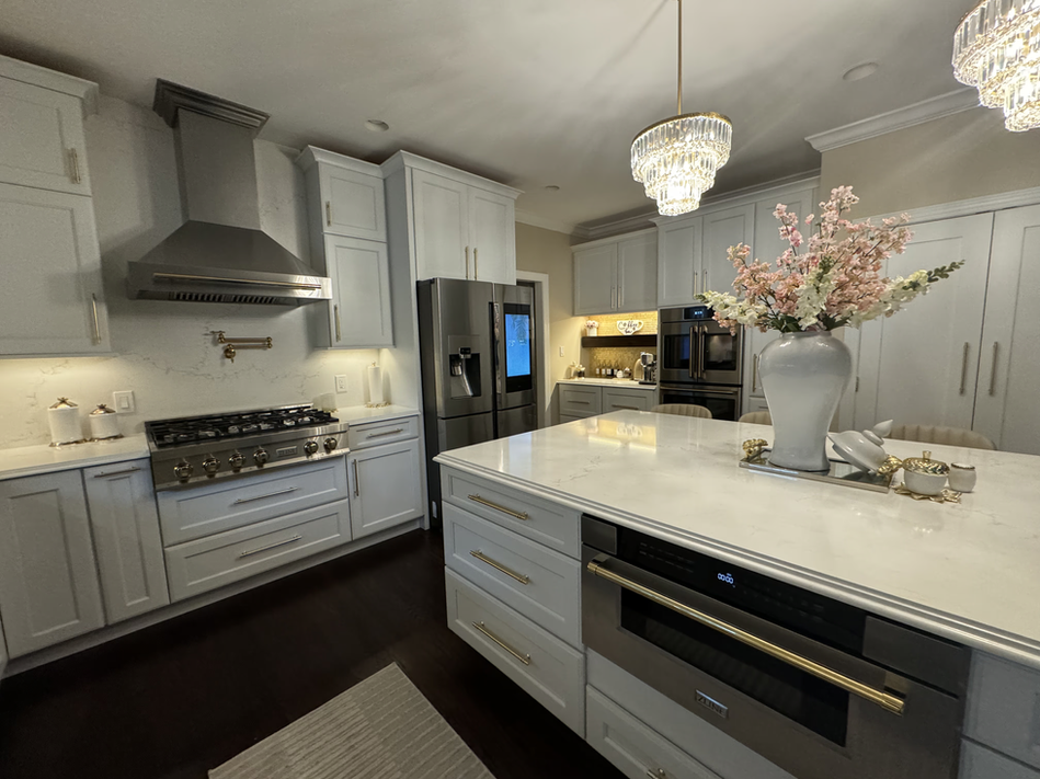 White Cabinet Kitchen with Gold Fixtures and Microwave Drawer