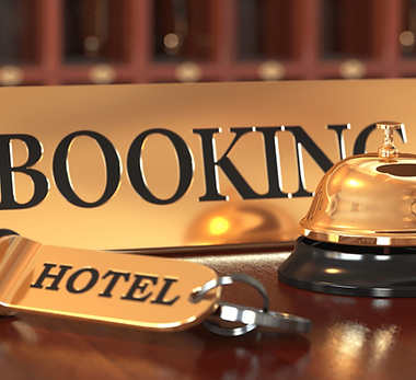 Hotel booking: reception bell, key, and "BOOKING" sign