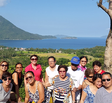 Group enjoying scenic overlook, beautiful bay view
