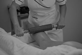 unrecognizable-therapist-performing-maderotherapy-woman-s-legs-during-massage-treatment-sp