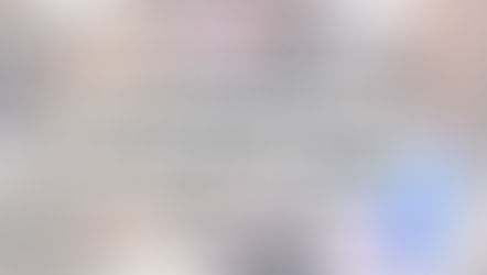 A woman mixes pancake batter in a pink bowl while two toddlers move around her in a kitchen. One toddler clings to her leg and the other wears a blue dress and holds a colorful toy. Text overlay reads, “Tell Me You Have a Toddler Without Telling Me You Have a Toddler.” Website link reads, makemindfulmemories.com.