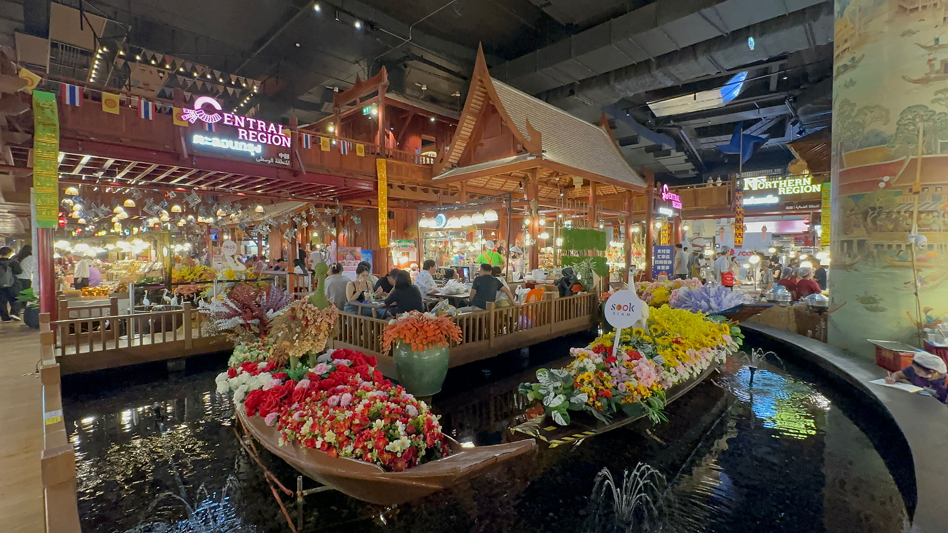 Colorful boats and shops at SookSiam Floating Market