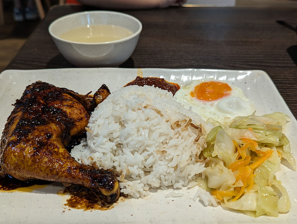 Ayam Bakar with rice, vegetables, fried egg, a spoonful of sambal and a bowl of soup