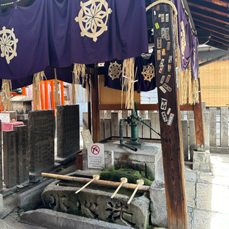 Water and wooden ladle used in purification ritual