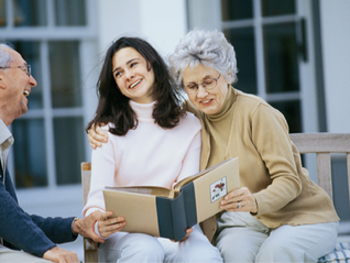 a middle-aged woman with her elderly parents